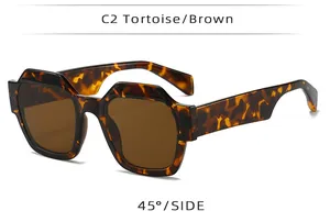 Detailed 45-degree side view of oversized tortoise shell sunglasses with brown lenses