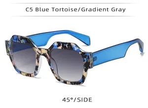 Side view of women's polygonal sunglasses in blue tortoise and gradient gray