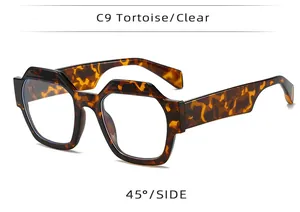 45-degree side view of oversized tortoiseshell polygonal glasses with clear lenses