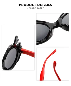 Detail shots showing hinges and red temples of kids cartoon dragon horn sunglasses.