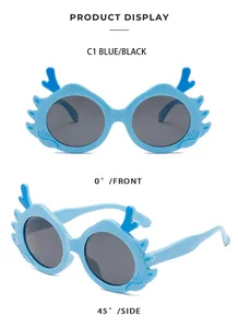 Detail view of cute blue dragon horn children sunglasses with UV protection lenses.