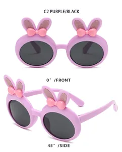 Detail showing children's purple rabbit ear sunglasses with cute pink bows from two angles
