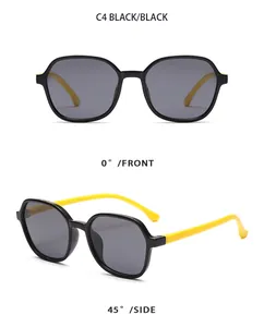 Detailed macro view of black and yellow children's sunglasses with polygonal frames