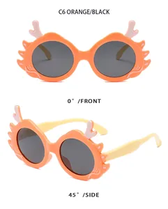 Front and side views of orange dragon horn children's sunglasses with black lenses.