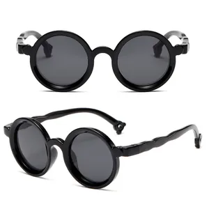 Trendy round children's sunglasses featuring soft silicone frames and dark polarized lenses for kids