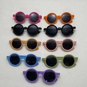 Collection of colorful round silicone sunglasses for children in various vibrant colors.