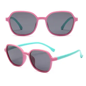 Polarized children's sunglasses with soft pink frames and light blue temples
