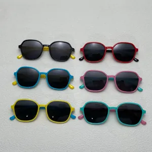 Assorted multi-color children's polarized sunglasses with soft silicone polygonal frames