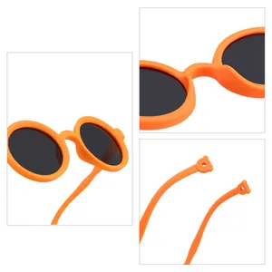 Orange round children's polarized sunglasses with soft silicone frame and UV protection