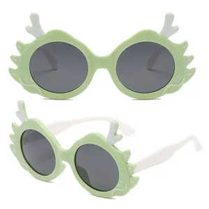 Cute kids cartoon dragon sunglasses with green frames and white temples for UV protection