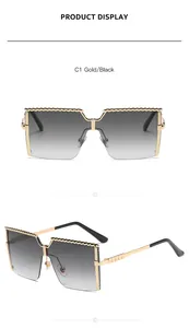 Detailed view of gold-rimmed children's square sunglasses with grey gradient lenses.
