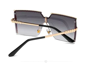 Detailed back view of stylish oversized children's metal semi-rimless sunglasses with gold temples