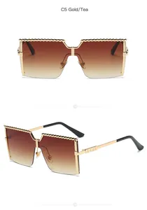 Detail view of gold-tone square children's sunglasses with brown gradient lenses.