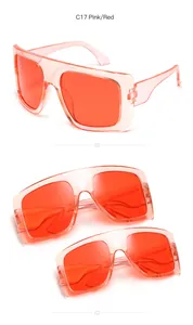 Detailed view of oversized square sunglasses for kids in vibrant pink and red