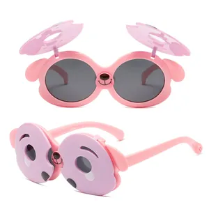 Cute pink dog-themed flip-up sunglasses for kids with polarized UV protection lenses