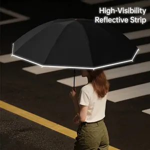 Large automatic black rain umbrella featuring a high-visibility safety reflective strip