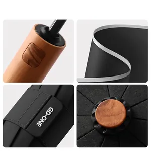 Detail views of 60-rib automatic large umbrella featuring wood-grain finish handle