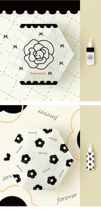 Detail view of two stylish mini 5-fold pocket umbrellas with chic flower patterns.
