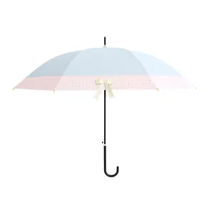 Elegant long-handle umbrella with light blue canopy and pink checkered bow detail.