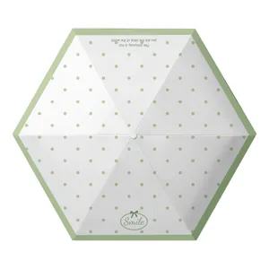 Portable five-fold sun and rain umbrella with green polka dots and UV protection