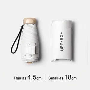 Minimalist white folding travel umbrella with UPF 50+ UV protection storage pouch