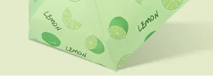 Macro detail of the light green lemon print on the umbrella canopy