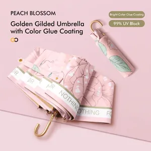 Pink floral folding sun umbrella with gold handle and 99% UV protection coating