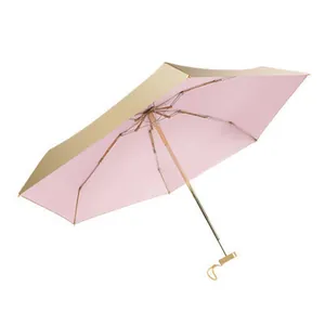 Portable 5-fold UV protection sun umbrella featuring pink interior and metallic gold exterior