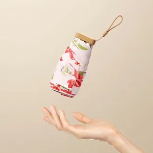 Ultra-lightweight compact floral folding umbrella for sun and rain protection mini pocket size
