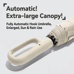 Large automatic folding umbrella featuring a unique carabiner hook handle in beige