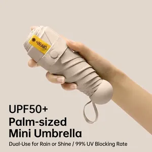 Portable beige capsule sun umbrella with UPF50+ protection, five-fold design.
