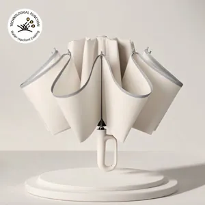 Cream-colored automatic reverse folding umbrella with a creative ring buckle handle