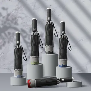 Automatic folding umbrellas for sun and rain protection on elegant display stands