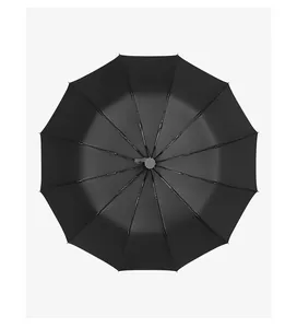 Top view of a large black automatic 12-rib umbrella showing its sturdy structure