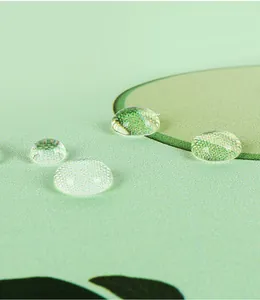 Detailed macro view of water droplets on the waterproof green umbrella fabric texture