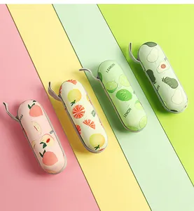 Four portable umbrella cases featuring peach, lemon, avocado and grapefruit patterns