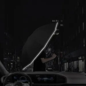 Large black automatic folding umbrella with reflective safety edge for night