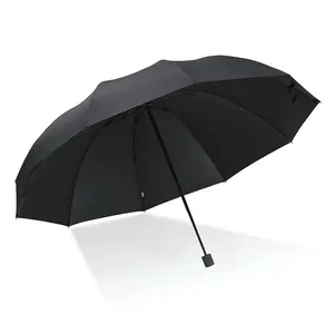 Large black folding umbrella for sun and rain protection with sturdy windproof frame