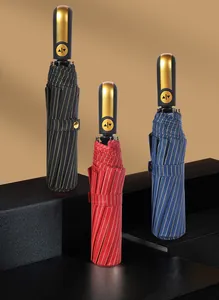 Automatic folding umbrellas in black, red, and blue colors with gold striped patterns.