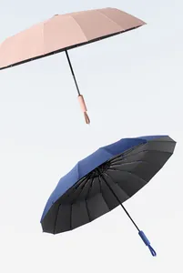 High-quality detail of 16-rib automatic folding umbrella in pink and navy blue.