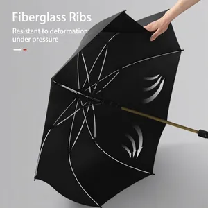 Large black windproof long-handle umbrella featuring durable and flexible fiber ribs for strength
