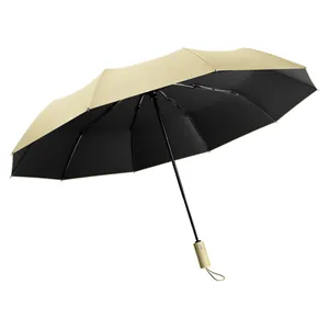 Large beige fully automatic folding umbrella with UV protection black coating layer