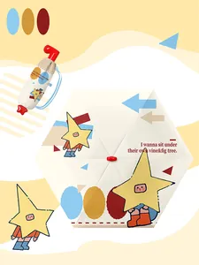 Close-up of the cute star character print on a compact foldable cream sun umbrella