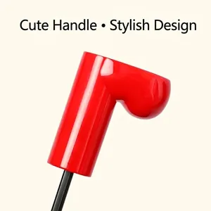 Vibrant red heart-shaped handle detail of a cute portable UV protection sun umbrella