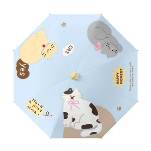 Blue foldable umbrella with cute cat prints and a yellow top pinwheel decoration