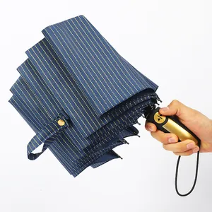 Large automatic folding umbrella with navy blue gold stripe pattern for sun and rain