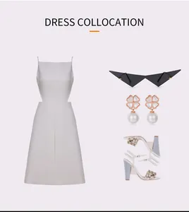 Modische Outfit-Idee mit dreieckiger Cateye-Sonnenbrille, Ohrringen und weißem Kleid