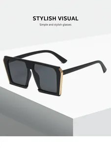 Detailed side view of oversized black flat top square sunglasses with gold accents