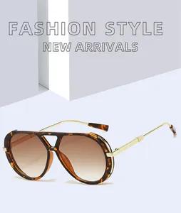 Detailed view of retro tortoiseshell sunglasses with gold-toned double bridge design
