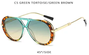 Side view of retro oversized sunglasses with tortoise shell frame and green gradient lenses